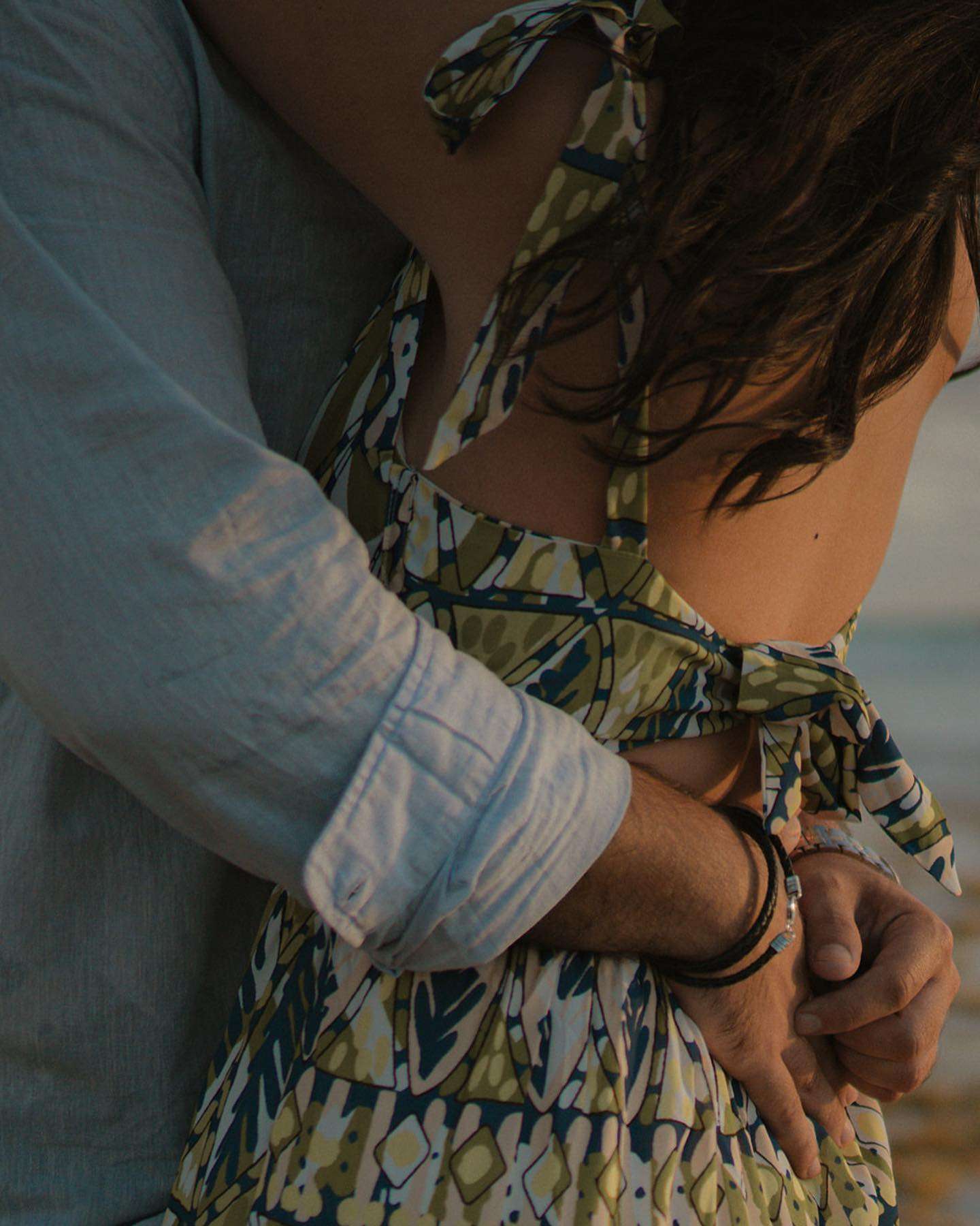A man and woman share a heartfelt hug, symbolizing love and support in their relationship.